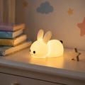 Farotiva rabbit silicone night light glowing on a bedroom shelf